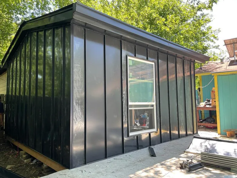 Black standing seam metal wall panels for Roof Inspection in Stoneham