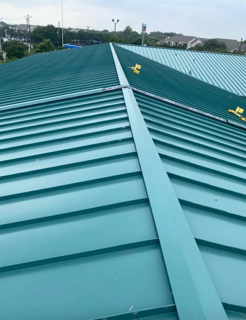 Green commercial metal roof ridge and valley for Metal Roof Repair in Stoneham